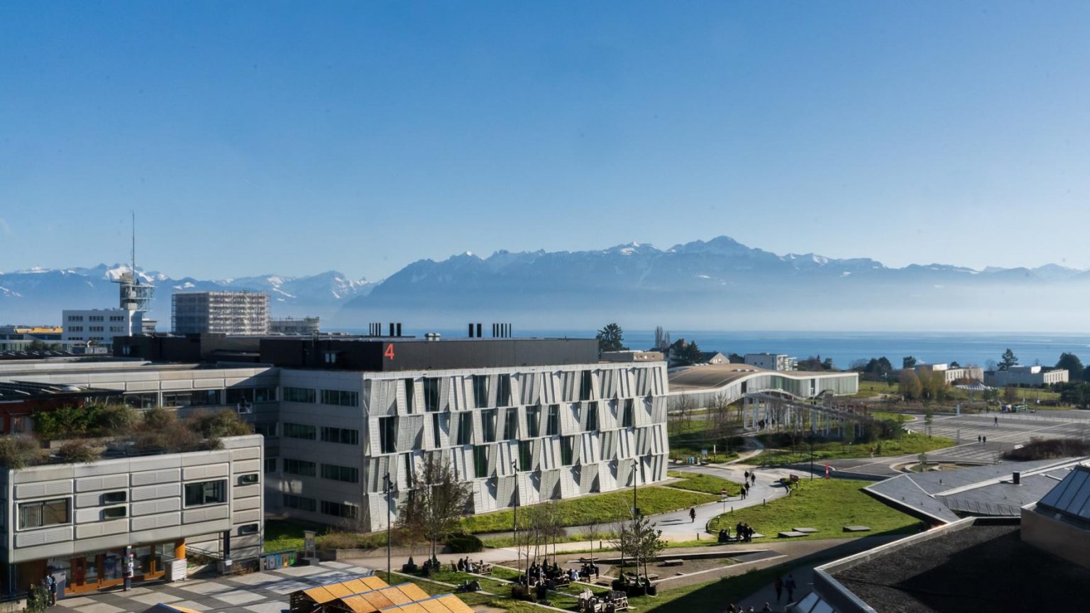 View from Esplanade EPFL to MED building, Lake Geneva and Alps. Winter